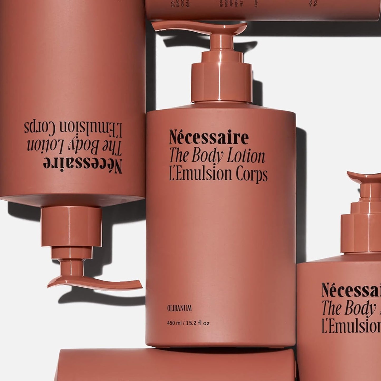 Nécessaire The Body Lotion with Pump. Olibanum. Multi-Peptide Firming to Moisturize + Strengthen. 2.5% Niacinamide, Vitamin C/E + Omega 6/9. Notes of Vanilla, Fig Leaf, & Cassis Buds. 450ml/15.2 fl oz